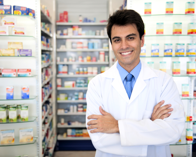 male pharmacist showing a medine